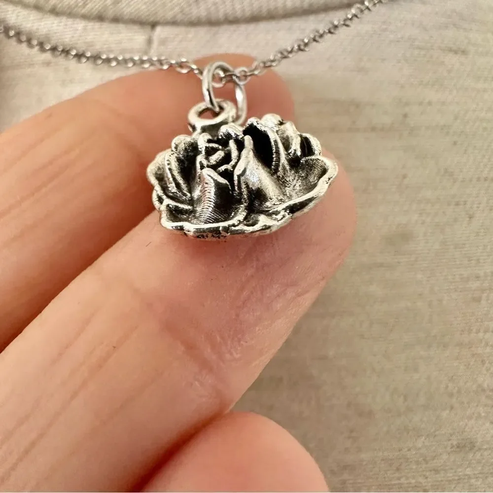 Silver tone rose pendant necklace